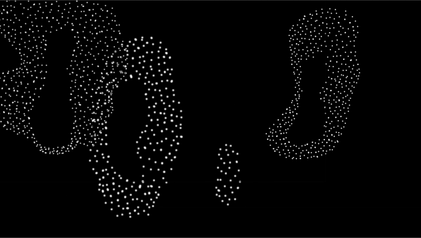 Standbild aus dem Musikvideo: abstrakte Formen aus weißen Punkten, auf schwarzem Hintergrund.